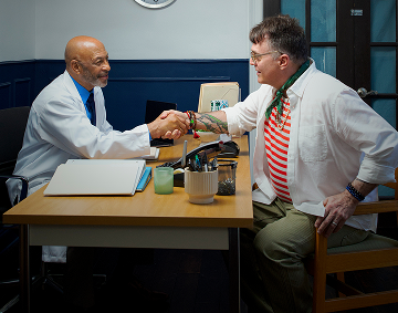 A Person Talking to a Health Care Provider, Seated Across From Each Other